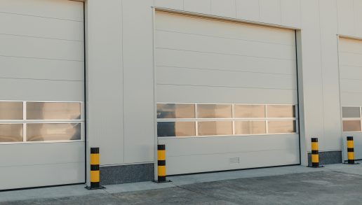 loading-doors-with-striped-bollards-on-gray-concre-2026-03-18-11-50-15-utc (1)